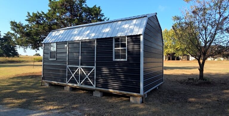Metal shed with white metal roof.